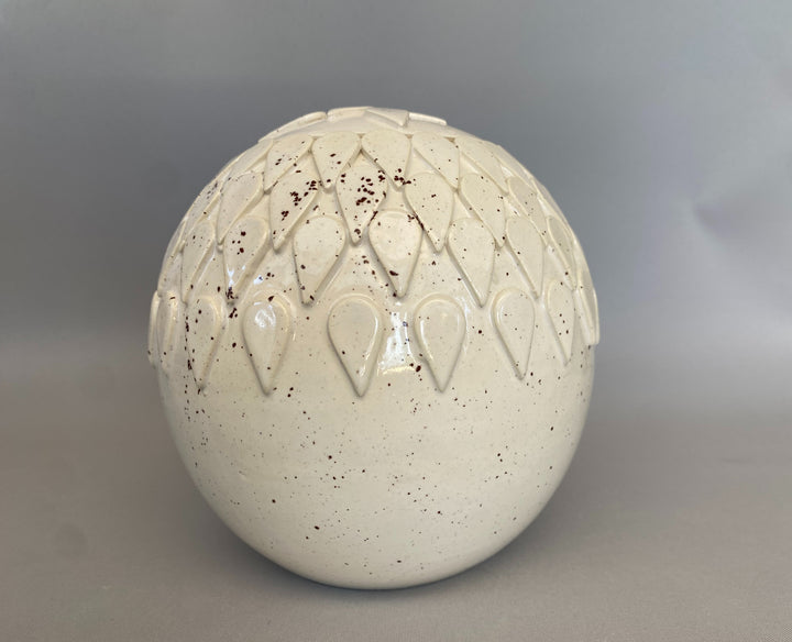 Handmade lidded jar in Dragon tooth design